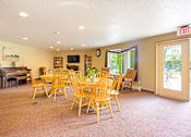 Thumbnail 12 of 31 - the dining room has a table and chairs and a piano