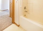 Thumbnail 9 of 31 - a bathroom with a shower and a door to a closet