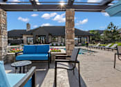 Thumbnail 54 of 60 - a patio with a couch and chairs in front of a house at The Vineyards of Colorado Springs, Colorado