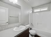 Thumbnail 8 of 28 - the preserve at ballantyne commons apartment bathroom with sink toilet and shower