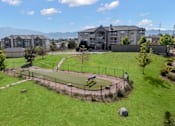 Thumbnail 60 of 60 - an aerial view of a park with apartments in the background at The Vineyards of Colorado Springs, Colorado Springs, 80920