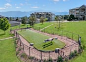 Thumbnail 56 of 60 - a park with a fenced in field and houses in the background at The Vineyards of Colorado Springs, Colorado Springs, Colorado