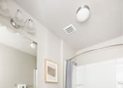 Thumbnail 12 of 26 - a bathroom with a toilet sink and bathtub in a 555 waverly unit at The Alloy at Geneva, Vineyard, 84058