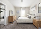 Thumbnail 9 of 26 - a bedroom with a bed and dresser at The Alloy at Geneva, Utah, 84058