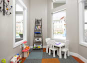Thumbnail 5 of 26 - a play room with a table and chairs and a ladder with toys at The Alloy at Geneva, Vineyard, UT, 84058