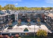 Thumbnail 41 of 48 - an aerial view of an apartment complex with trees in the background at River Walk Apartments, Boise