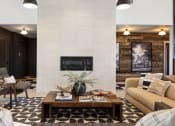 Thumbnail 4 of 45 - a living room with a fireplace and a coffee table at The Expo, Billings, 59106