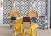Thumbnail 11 of 45 - a room with a table and chairs and a wall with a geometric pattern at The Expo, Billings, 59106