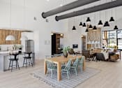 Thumbnail 10 of 45 - A modern kitchen with a dining table and chairs.