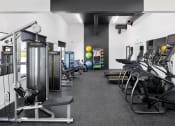 Thumbnail 14 of 45 - a spacious exercise room with cardio equipment and weights at The Expo, Billings, MT, 59106
