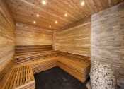Thumbnail 13 of 45 - an infrared sauna with wooden walls and benches at The Expo, Billings, MT