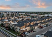 Thumbnail 20 of 61 - A residential area with houses and cars parked on the street. at Verraso Village Apartments, Meridian, Idaho