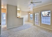 Thumbnail 36 of 60 - an empty living room with a ceiling fan at The Vineyards of Colorado Springs, Colorado Springs