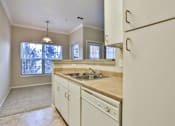 Thumbnail 40 of 60 - a kitchen with white cabinets and a sink at The Vineyards of Colorado Springs, Colorado Springs, Colorado