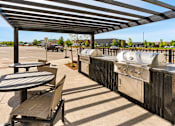 Thumbnail 74 of 98 - A patio with a table and chairs at The Beaumont Apartments, Bozeman, 59715