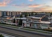 Thumbnail 19 of 61 - A street view of a residential area with houses and apartment buildings. at Verraso Village Apartments, Idaho, 83646