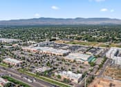 Thumbnail 56 of 61 - A cityscape with buildings and roads under a clear sky. at Verraso Village Apartments, Meridian 83646