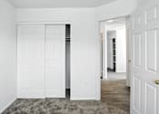 Thumbnail 30 of 43 - A white door is open to a hallway. at Oakstone Apartments, Clearfield