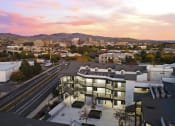 Thumbnail 5 of 48 - an aerial view of a building with a city in the background at River Walk Apartments, Boise, Idaho