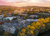 Thumbnail 2 of 48 - an aerial view of the city at sunset at River Walk Apartments, Idaho