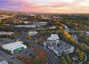 Thumbnail 45 of 48 - an aerial view of a city with a river and buildings at River Walk Apartments, Boise