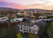 Thumbnail 47 of 48 - an aerial view of a building with a city in the background at River Walk Apartments, Boise, ID, 83702