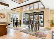 Thumbnail 19 of 35 - a dining room with a table and chairs in front of a window at Corso Apartments, Missoula, MT