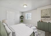 Thumbnail 5 of 28 - a white bedroom with a white bed and a green couch
