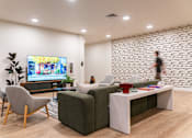Thumbnail 13 of 52 - Community Lounge With TV at Copestone Apartments, Garden City, ID