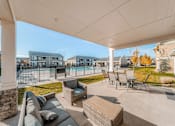 Thumbnail 18 of 28 - the preserve at ballantyne commons covered patio with furniture and a pool