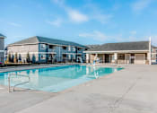 Thumbnail 24 of 28 - our apartments have a swimming pool with a building in the background