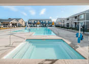 Thumbnail 19 of 28 - the preserve at ballantyne commons pool with apartment buildings