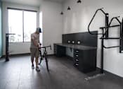 Thumbnail 17 of 67 - Bike storage and gear shop area at Cycle Apartments, Colorado