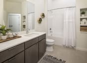 Thumbnail 18 of 26 - a bathroom with a sink and a toilet and a shower