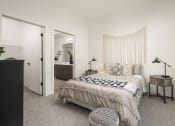 Thumbnail 17 of 26 - a bedroom with a large bed and a closet