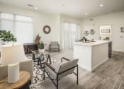 Thumbnail 9 of 26 - a living room with a kitchen and a dining room