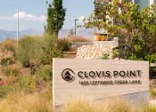Thumbnail 19 of 26 - a sign that reads clovis point in front of a building