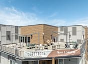 Thumbnail 15 of 29 - A building with a sign that says "COPESTONE Apartments" and "Now Leasing" is shown.