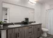 Thumbnail 4 of 28 - a bathroom with two sinks and a toilet and a mirror at Crosshatch, Idaho