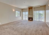 Thumbnail 5 of 20 - Carpeted Living Area at C.W. Moore Apartments, Boise