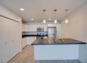 Thumbnail 11 of 37 - Granite Countertop Kitchen at West Village at Four Points, Montana, 59718