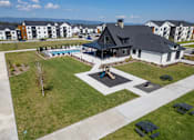 Thumbnail 50 of 64 - A large house with a pool in the backyard. at Silverbrook Apartments, Kalispell, MT