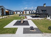 Thumbnail 55 of 64 - A black and white checkered pattern is in the middle of a grassy area at Silverbrook Apartments, Montana, 59901