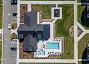 Thumbnail 53 of 64 - A large building with a pool in front of it. at Silverbrook Apartments, Kalispell