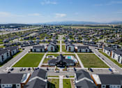 Thumbnail 56 of 64 - A bird's eye view of a residential area with houses and a park. at Silverbrook Apartments, Kalispell, MT, 59901
