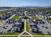 Thumbnail 48 of 64 - A bird's eye view of a residential area with houses and cars. at Silverbrook Apartments, Montana
