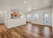 Thumbnail 23 of 64 - A spacious kitchen with wooden floors and white walls at Silverbrook Apartments, Kalispell, Montana 59901