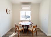 Thumbnail 7 of 64 - A dining room with a table and chairs. at Silverbrook Apartments, Kalispell, Montana