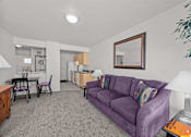 Thumbnail 13 of 46 - room with a purple couch and mirror on the wall at Great Northern, Missoula