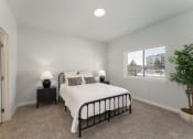 Thumbnail 25 of 45 - Bedroom with cozy bed at The Expo Apartments, Montana